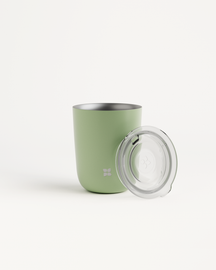 Steel Cup Set with Sip Lid designed for hot and cold drinks, featuring a double-walled green cup and a clear plastic lid with a silver rim.