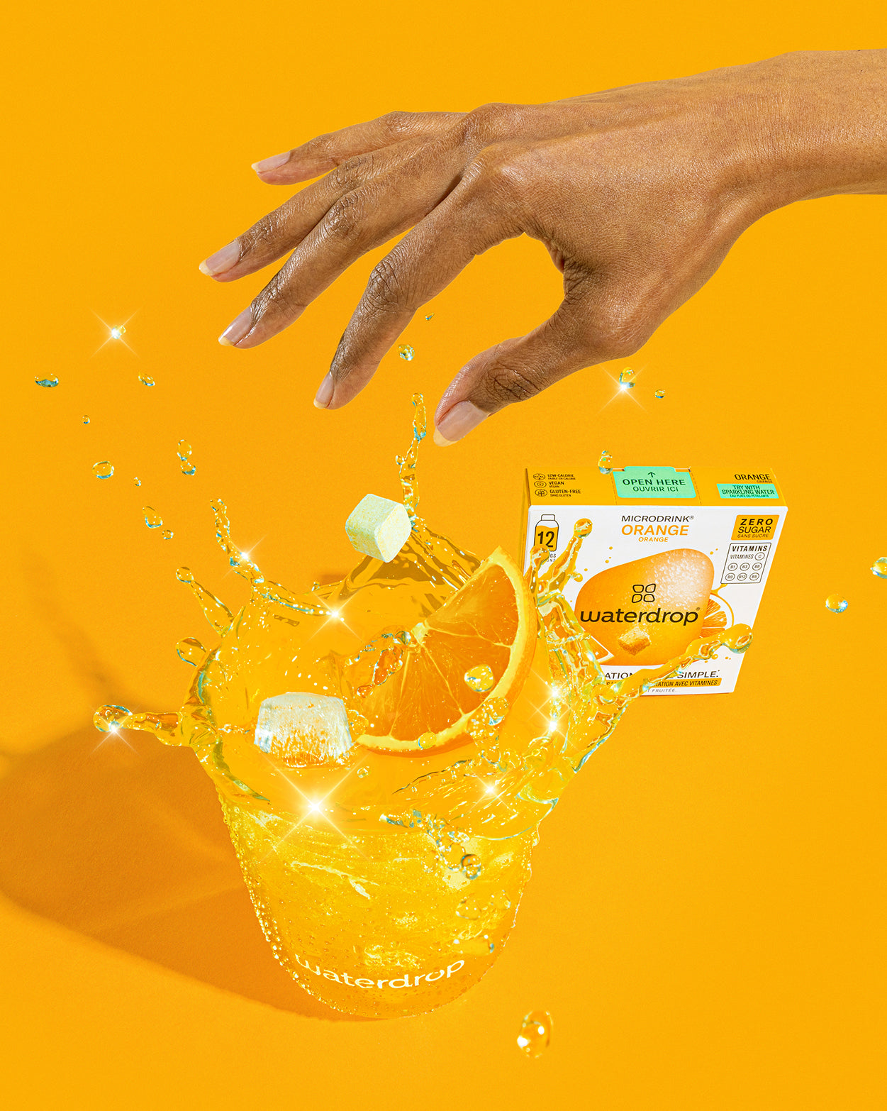 Fizzy Refreshment Twin Pack: Sparkling water with orange microdrink cubes.