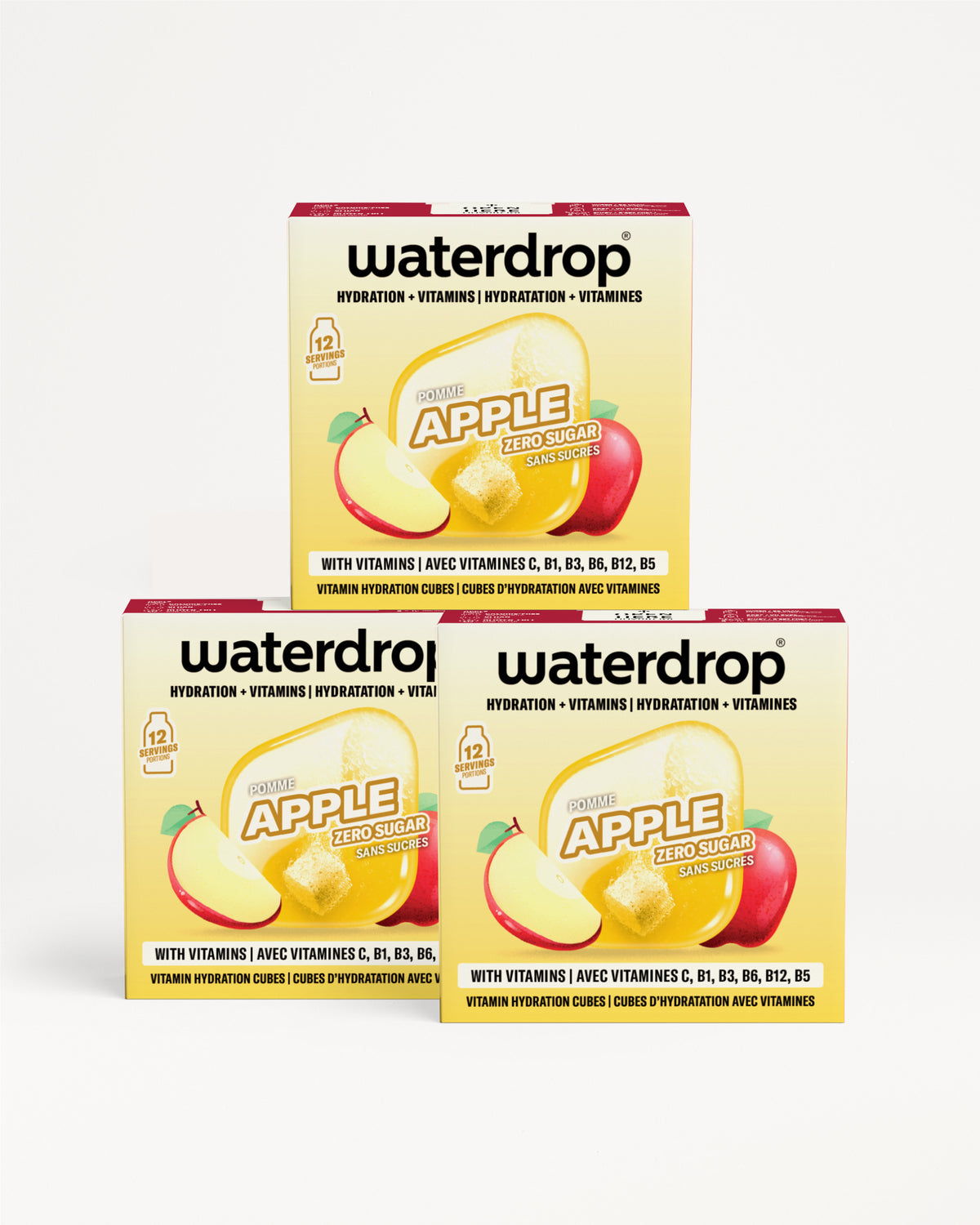Три кутии Waterdrop јаболкови хидратациони витамини капи поставени во пирамидална форма.