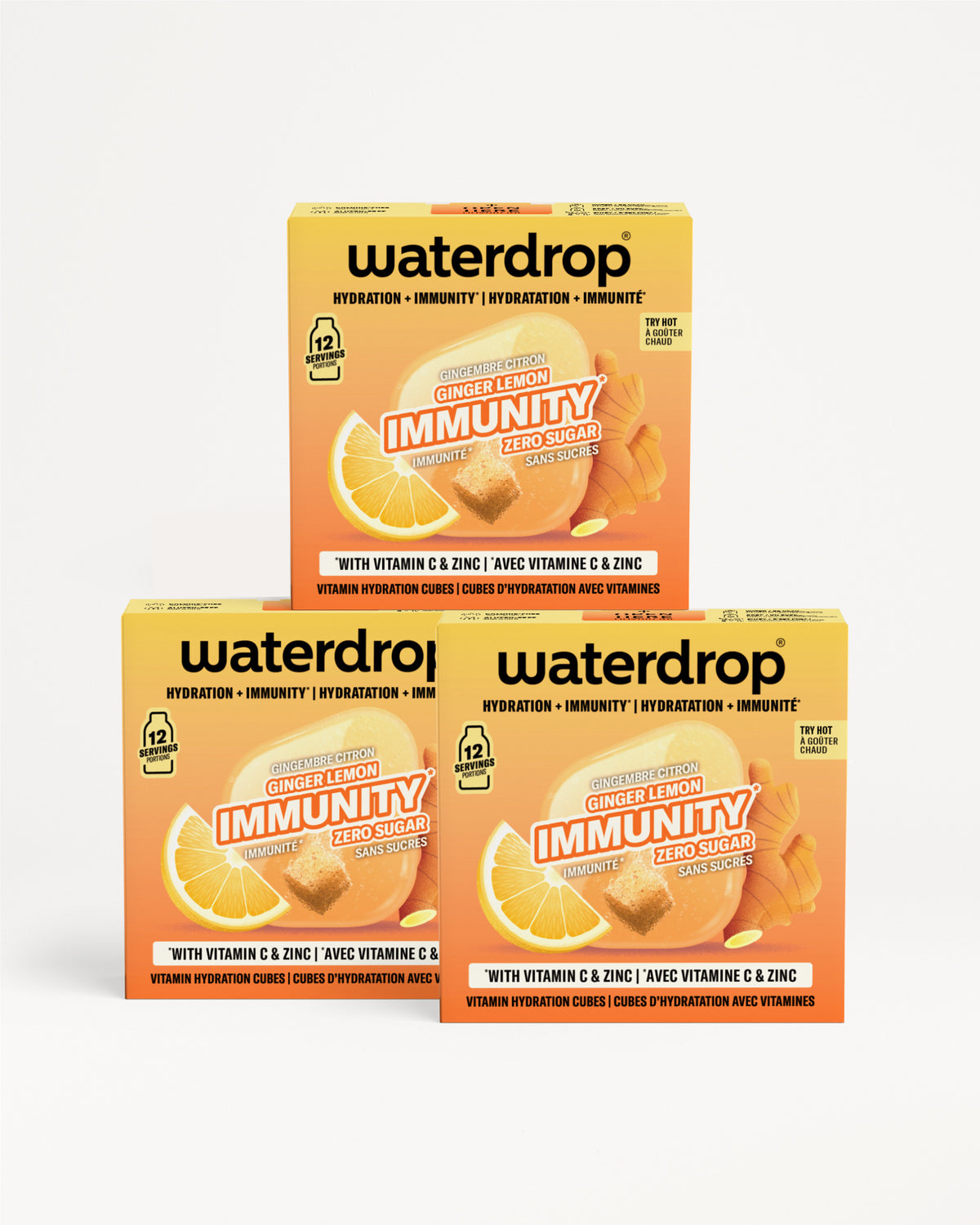 Три портокалови кутии Waterdrop Immunity со витамин Ц и цинк, поставени во пирамида.